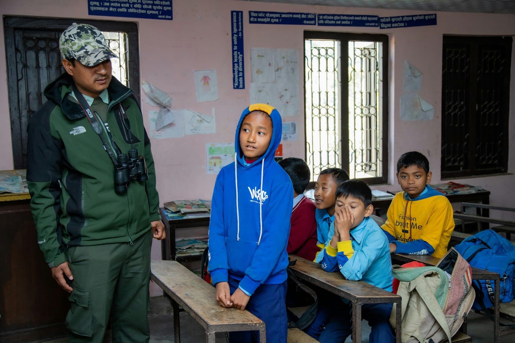 An educator speaking with children during an interactive session in Nepal